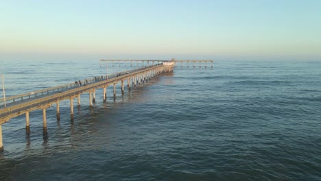 Drone-flying-down-the-Ocean-Beach-Pier-in-San-Diego-California