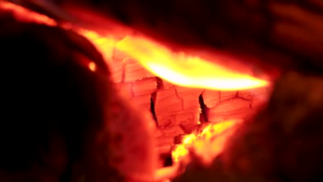 Very-close-view-of-fire-burning-wood,-macro-shot-detail-video