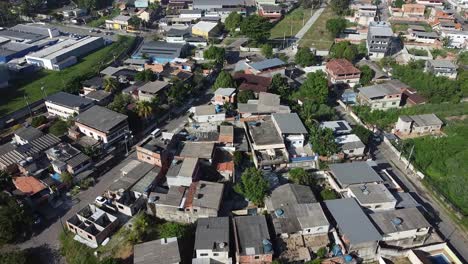 aerial drone of houses and favelas of duque de caxias - rio de janeiro - daylight