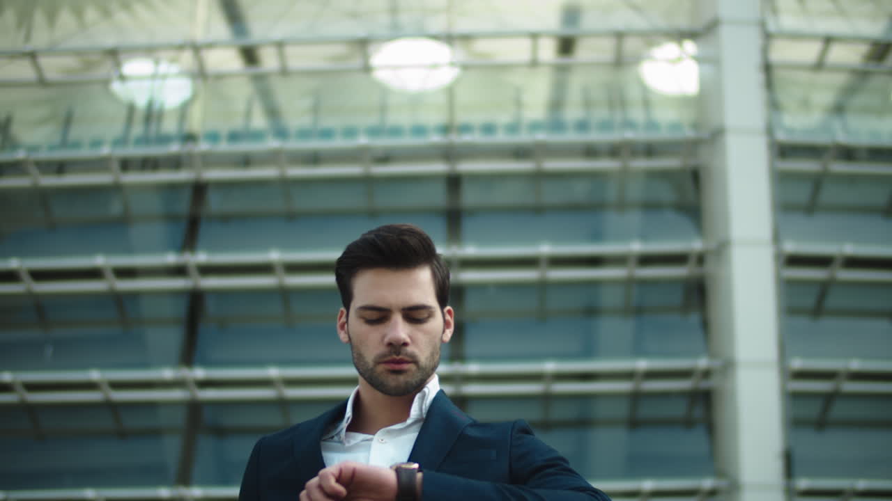 Close up view of confident businessman walking down stair in slow motion