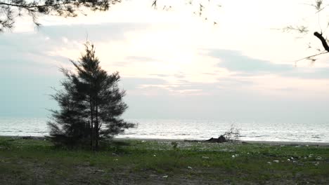 underated sunset gerigat beach,fishing village kabong.white sandy beach,green coconut trees and blue sea,sky sarawak,borneo.