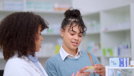 Helpful-female-chemist-assisting-a-customer