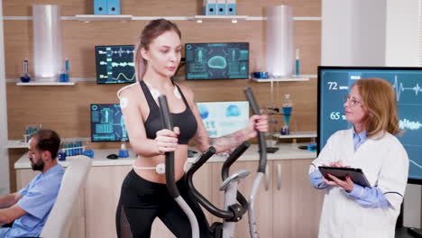 female athlete testing her heart rate in a sport centre