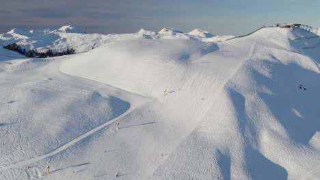 Skiers-On-The-Slope-Of-Saalbach-Hinterglemm-Mountain-In-Austria---Aerial-Drone-Shot