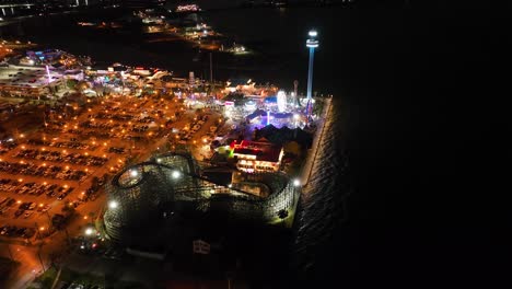 galveston, texas - march 1, 2023: aerial drone view of the pleasure pier of the city at night