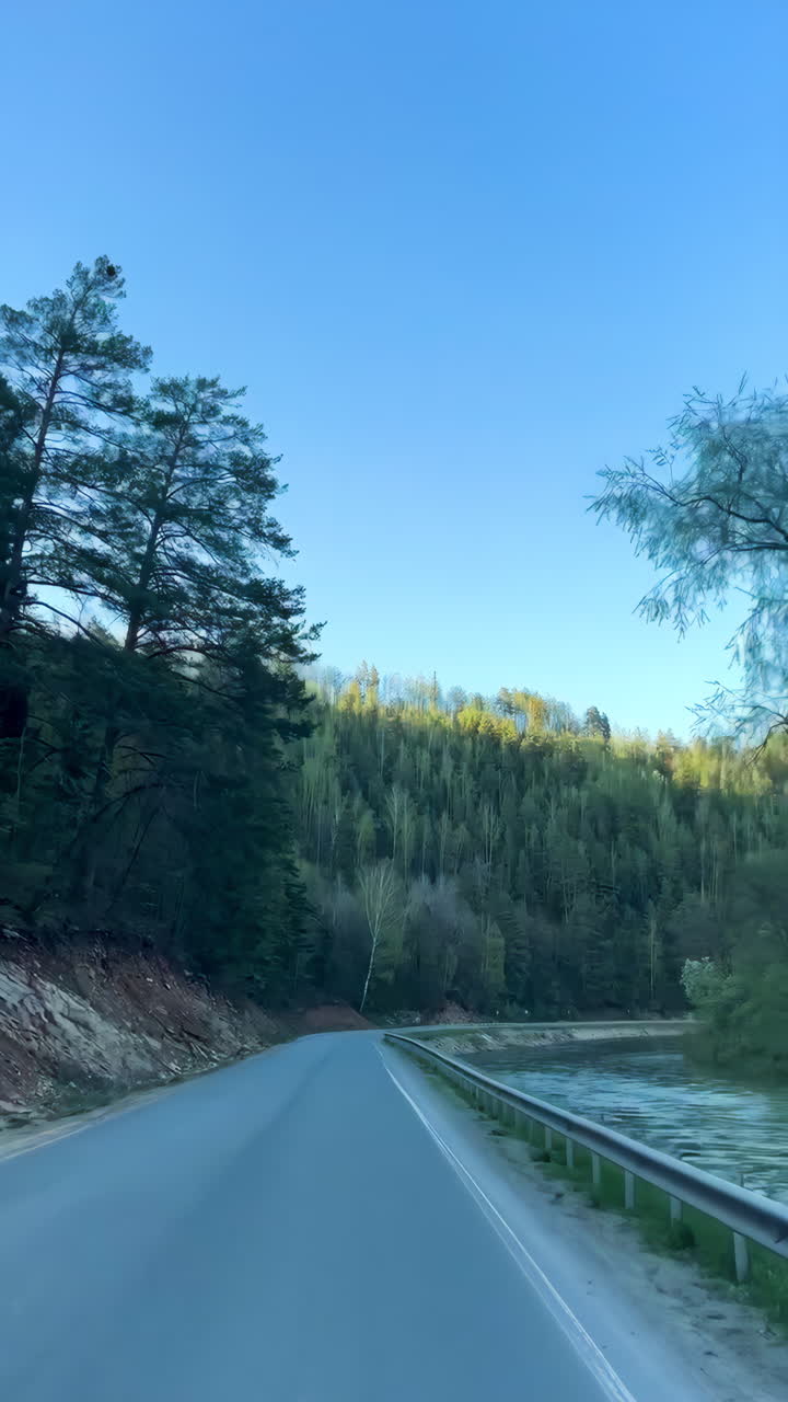 Serene Mountain Road with River View