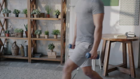 man doing dumbbell lunges and arm exercises at home