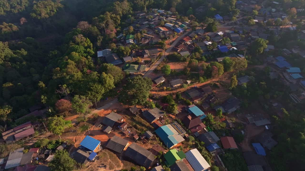 Drone capture of jungle-fringed slum dwellings, Thailand