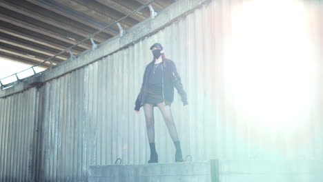 Woman-standing-on-urban-street.-Girl-wearing-face-mask-during-street-protest