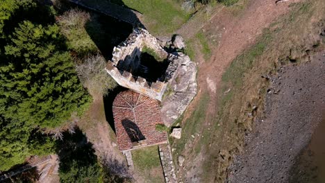 Tower-and-hermitage-second-century-BC-Atlantic-Sea,-Viking-invasion,-historical-artistic-monument,-National-Artistic-Treasure,-sunny,-overhead-drone-shot-traveling-forward