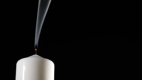 extinguished candle with beautiful dancing smoke