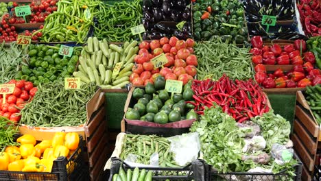 fresh vegetables on display at a market stall