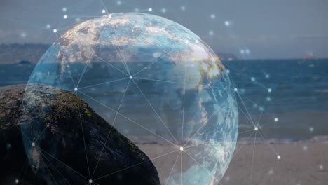 Animation-of-globe-and-connections-over-beach