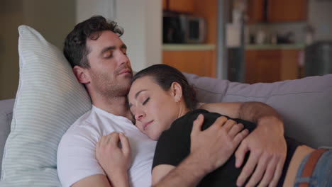 couple, love and sleeping on sofa to relax