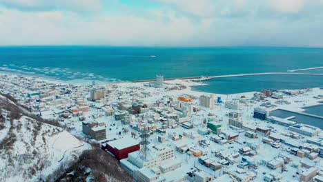 wakkanai in winter under a blanket of snow and a blue ocean