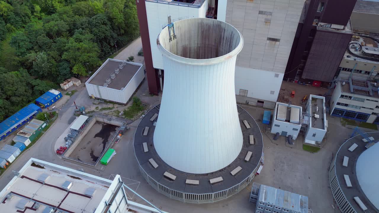 2 crane dismantling a power plant during a demolition process. Beautiful aerial view flight static tripod hovering drone