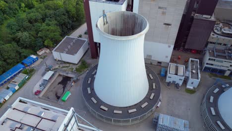 2 crane dismantling a power plant during a demolition process. beautiful aerial view flight static tripod hovering drone