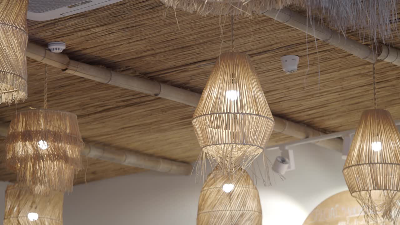 Interior with straw lamps and bamboo ceiling