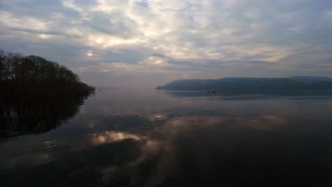 misty scene over lake windermere in the english lake district national park