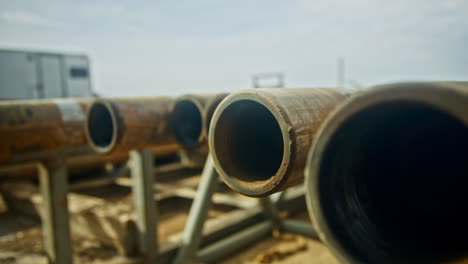 looking inside the metal pipes with rifle. equipment for oil or gas production. close up.