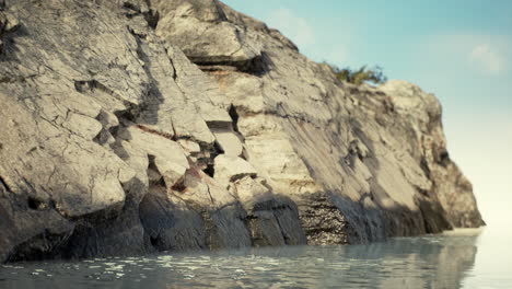 tropical rock island against blue sky and sea