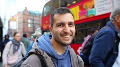 happy man smiling on a london street