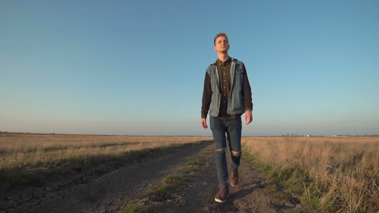 Teenager Walking on a Country Road