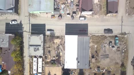 An-aerial-dolly-top-down-shot-of-Silver-Plume-Colorado-that-looks-like-an-old-cowboy-town-with-old-ruined-buildings-and-cars-ghost-town-shot-in-4k-mid-day