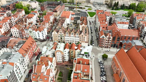 historic buildings of old town in polish city during sunny day