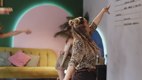 friends dancing in a lively cafe
