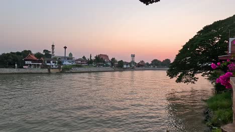 time-lapse of a sunset by a calm river