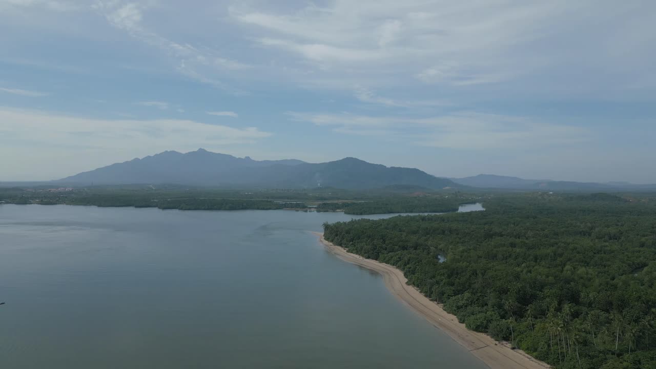 Aerial View of Tropical Coastline with Mountains