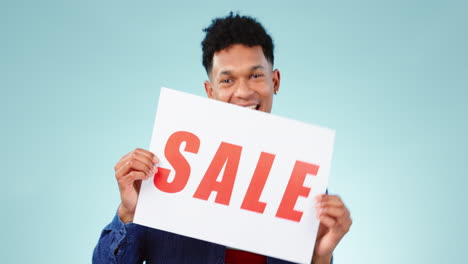 happy, man and sale poster in studio with dance