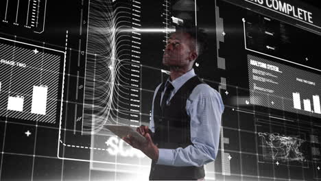 Young African American businessman using tablet and look at curves