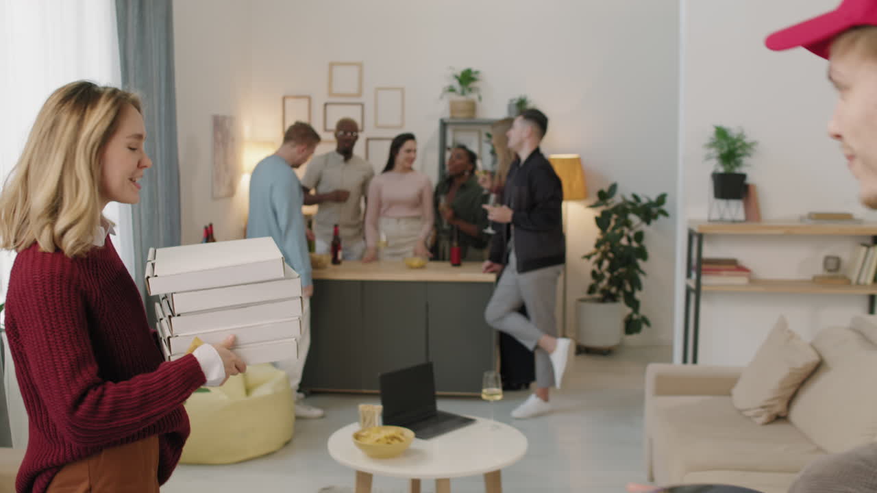 Woman Paying for Pizza at Home