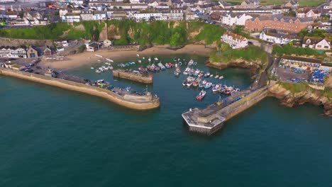 Aerial-Overview-Of-Harbour-With-Boat-Manoeuvring-Below