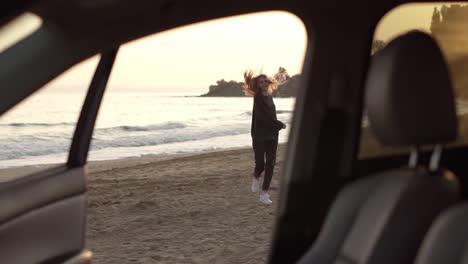 Woman-in-slow-motion-running-from-car-through-the-sea-beach,-feel-exciting-on-sea-beach