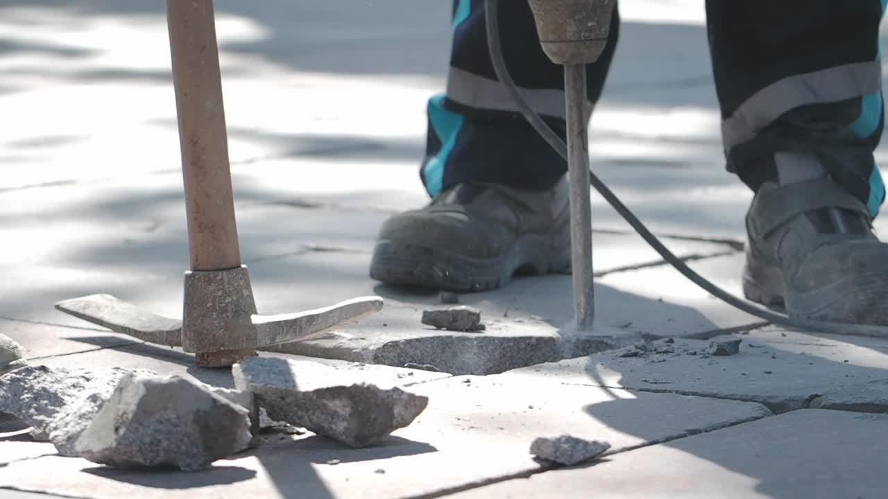 Construction work on the pavement with a jackhammer
