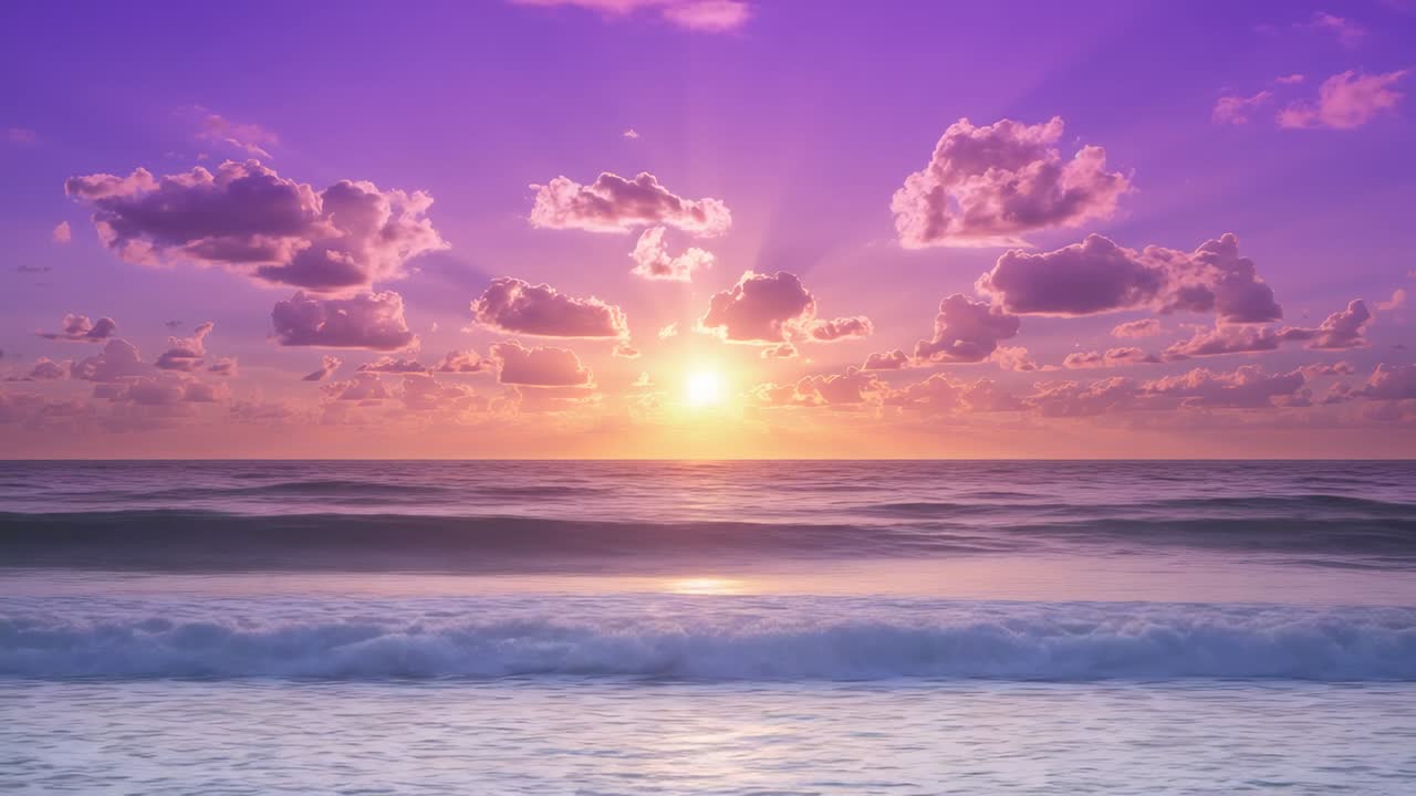 Rising sun reflecting on rippling water at shoreline during dawn, with white foam