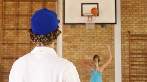 determined high school kids playing basketball