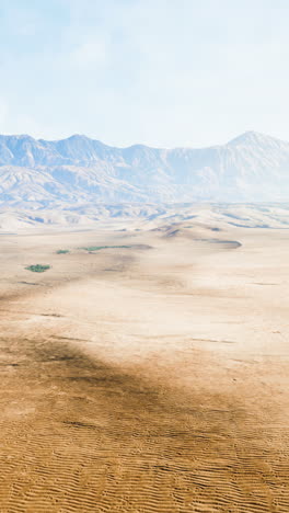 vast desert landscape with mountains in the background