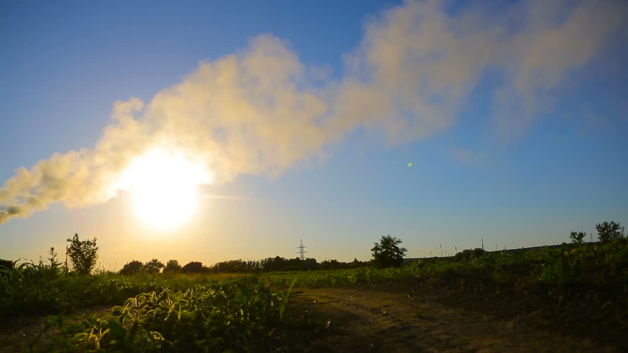 Child Hand With Paper Plane. Kid spend time in grass and playing with paper plane near air pollution