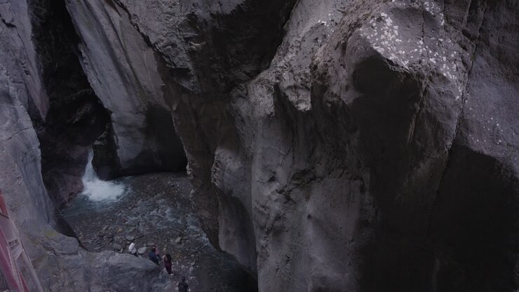 Scenic canyon with waterfall and rock formations