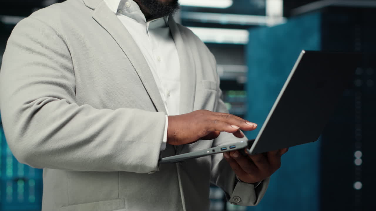 Vertical video Close up of engineer walking in data center workplace, checking gear