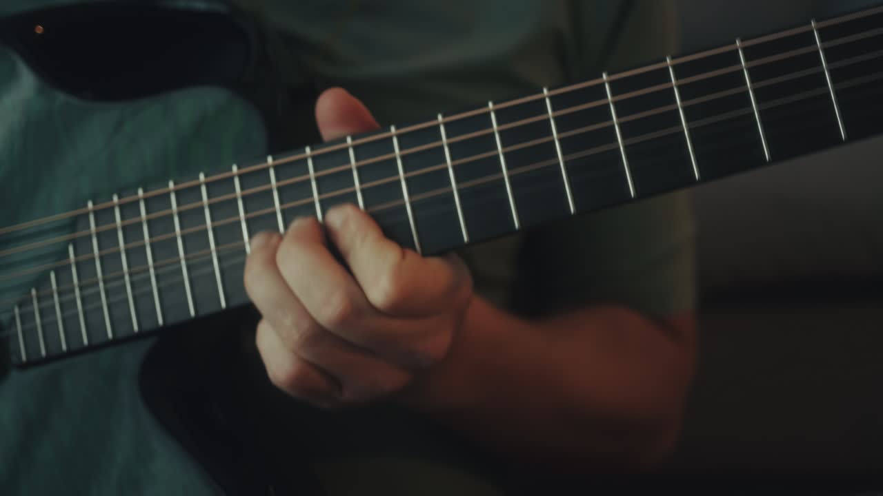 Close-up of a Hand Playing Acoustic Guitar