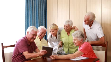 female doctor interacting with senior citizens