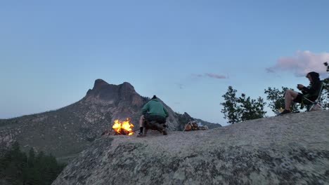 Campers-at-San-Isabel-with-views-of-Sheeprock,-campfire-atop-boulder