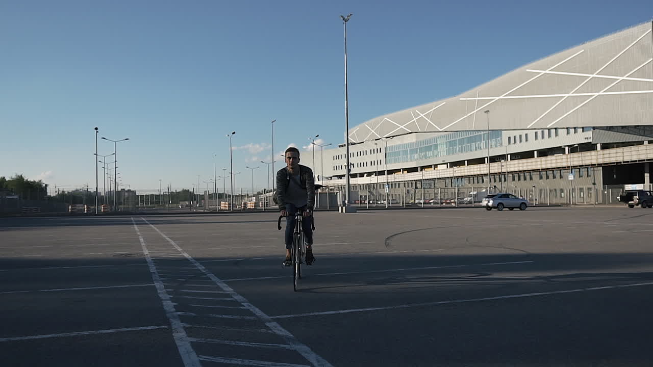 Cyclist in parking lot