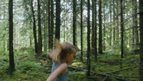 young free spirit tomboy runs through woods in summer, close profile tracking