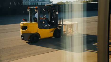 forklift transporting pallets